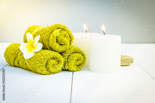 Beauty spa background with burning candles and massage stones, retro toned