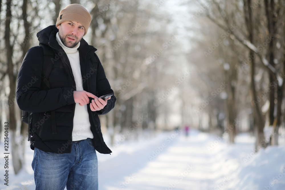 A man with a backpack frosty winter