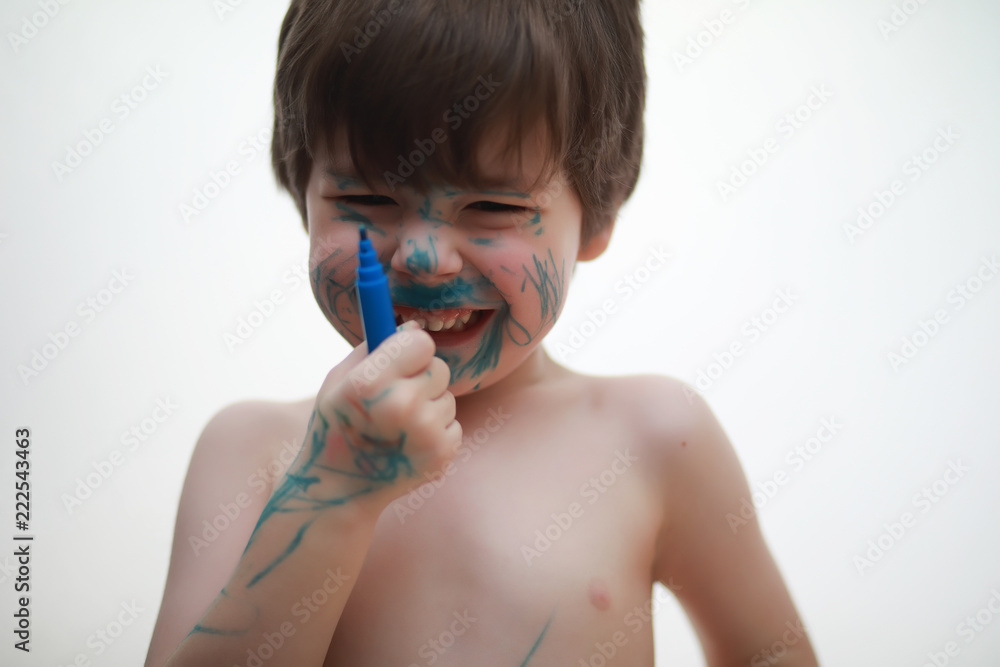 A child painted his face with colors