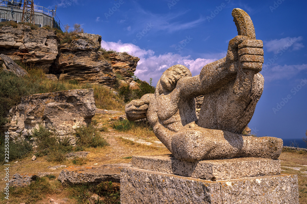 Stone statue of an archer in front of the Chapel of St. Nicholas at Cape Kaliakra