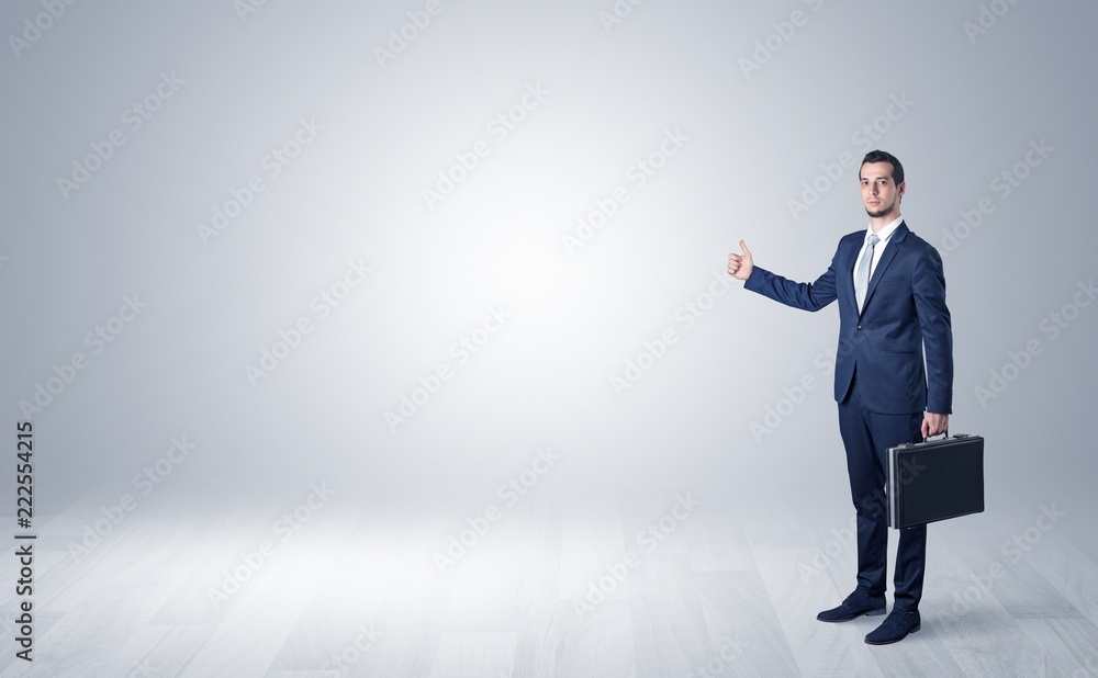 Lonely businessman hitchhikes concept with copy space around him
Lonely businessman hitchhikes concept with copy space around him