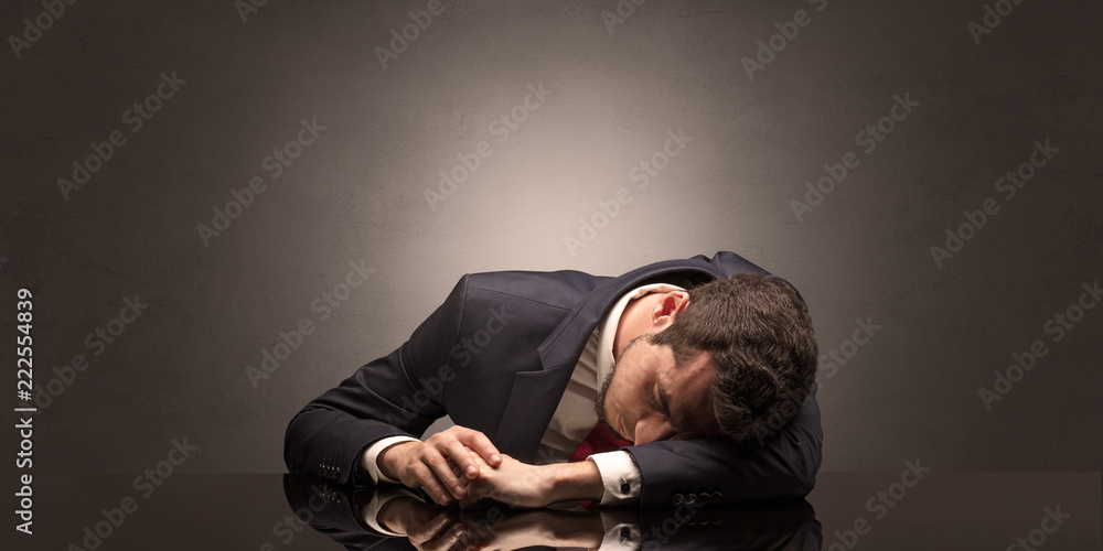 Young businessman fell asleep at his workplace with copy space Young businessman fell asleep at his workplace with copy space