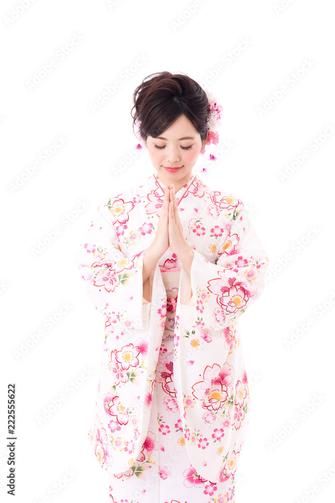 portrait of young asian woman wearing pink kimono on white background
