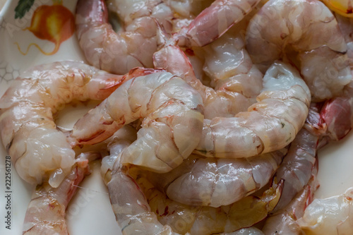 Fresh raw shrimp on plate with nature light