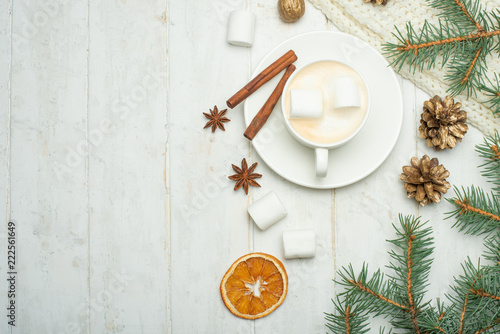 Christmas composition in Scandinavian style. Christmas gifts, coffee with marshmallows, pine cones, spruce branches on a wooden white background. Flat lay. view from above, place to copy. Banner