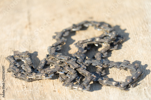 Old chainsaw chain. Place for your text.