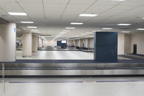 Empty baggage conveyor belt at the airport photo