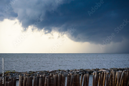 Rain strom cloudy darkness frightening sky in rainy season black dark color tone.