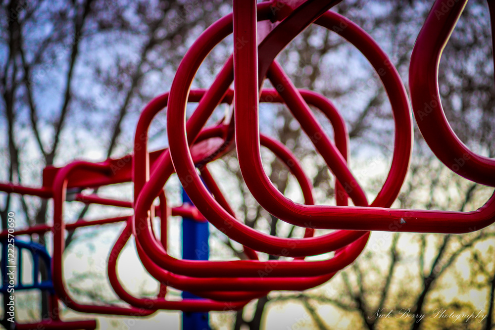 Close up view of colorful playground equipment beneath bright blue skies Close up view of colorful playground equipment beneath bright blue skies