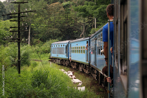 Tourists feeling happy along the way on the scenic blue train to Ella