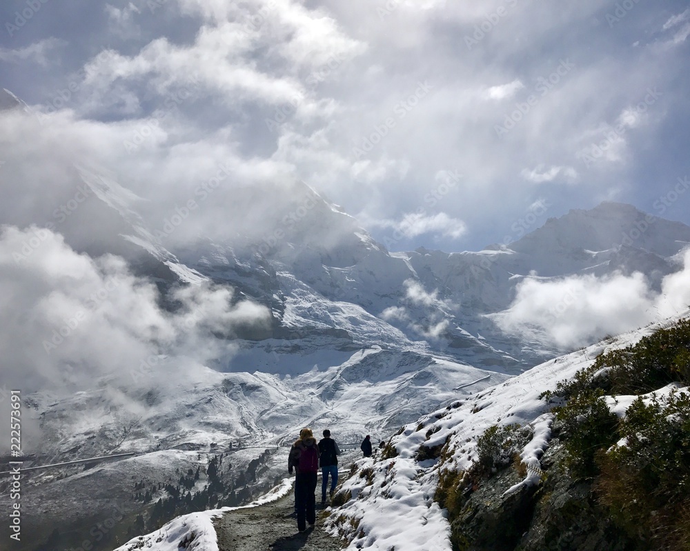 hiker in the mountains with snow