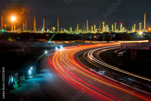 beautiful lighting of oil refinery plant in heavy petrochemical industry estate use for power,Road to the oil refiner on blue sky in twilight time background photo