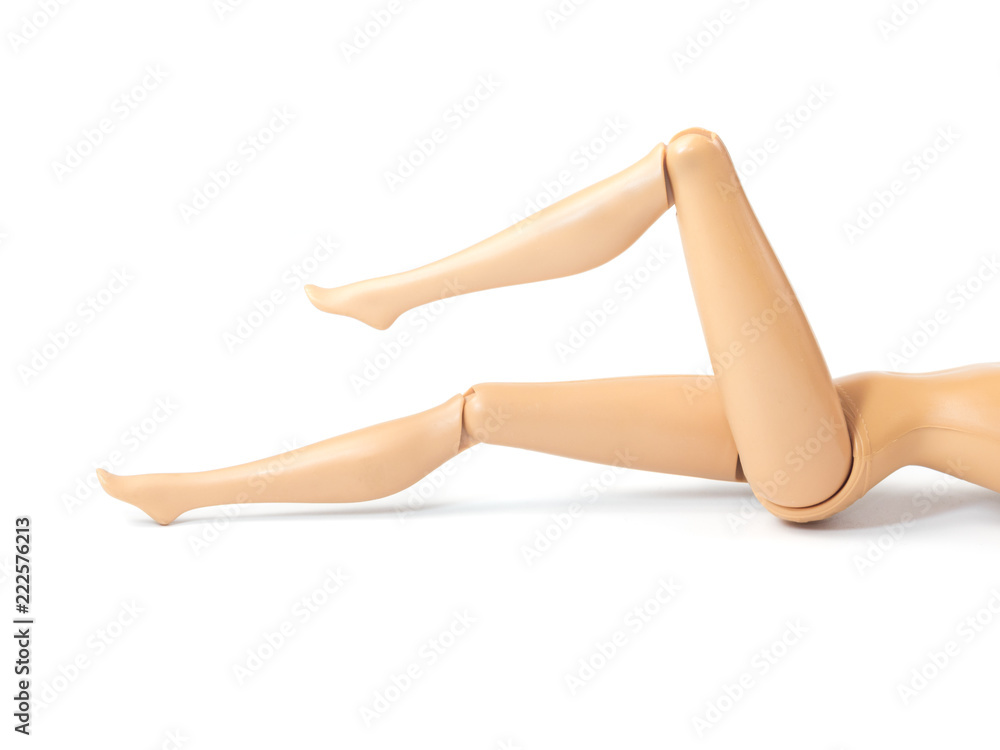 The beautiful slender legs of pretty figure girl doll doing gestures sexy isolated on white background