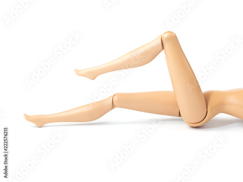 The beautiful slender legs of pretty figure girl doll doing gestures sexy isolated on white background