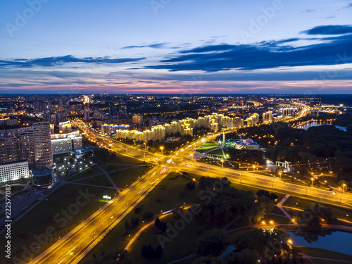 Aerial top view of illuminated city road and modern apartment buildings, Minsk, Belarus