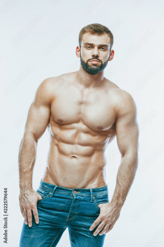 bodybuilder posing. Beautiful sporty guy male power. Fitness mus bodybuilder posing. Beautiful sporty guy male power. Fitness mus