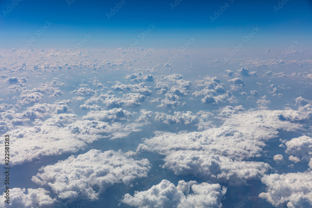 Fototapeta premium Cloudscape background. View out of an airplane window.