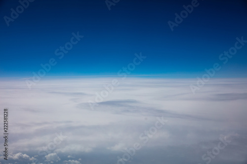 Cloudscape background. View out of an airplane window.