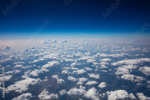 Cloudscape background. View out of an airplane window.