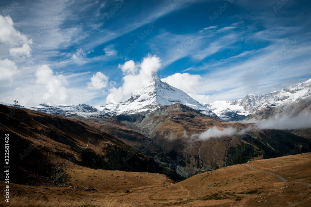 Matterhorn with cloud and snow against blue sky 