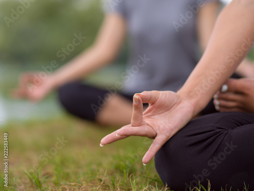 women meditating and doing yoga exercise