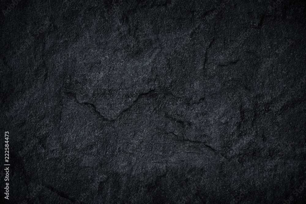 Naklejka premium Dark grey black slate stone background or texture