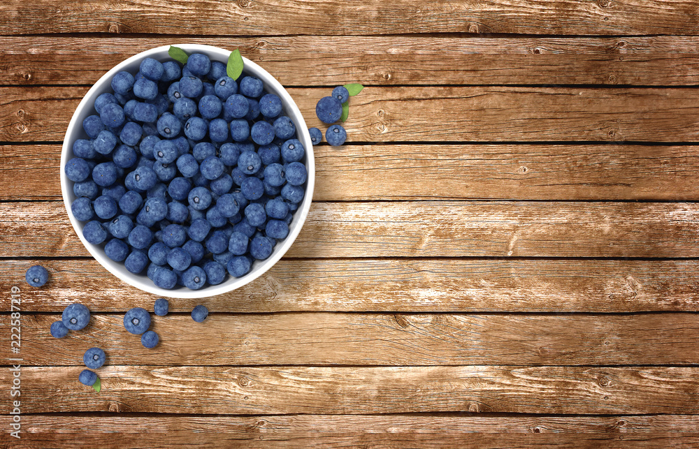 3D render. Bowl full of blueberries on wooden table. 3D render. Bowl full of blueberries on wooden table.