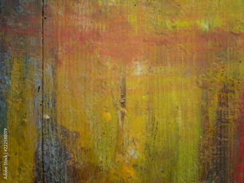 Thick layers of paint on a wooden board