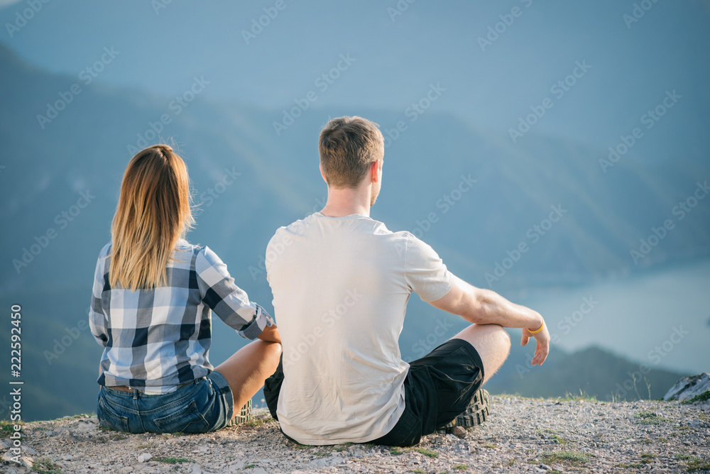 young couple doing yoga in nature