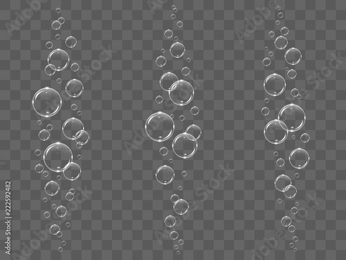 Transparent white bubbles flying in air or underwater, isolated on black background