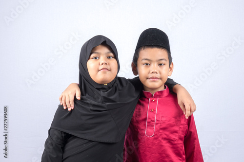 Potrait of young asian muslim boy/girl isolated on white background. photo