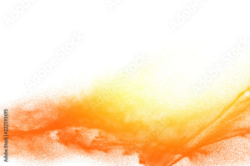 Canvastavla Yellow orange dust particles explosion on white background