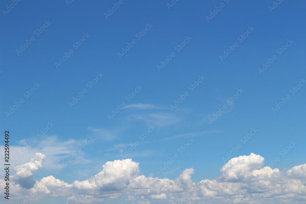 The summer cloud spreading in the blue sky The summer cloud spreading in the blue sky