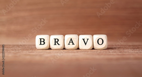 Word BRAVO made with wood building blocks