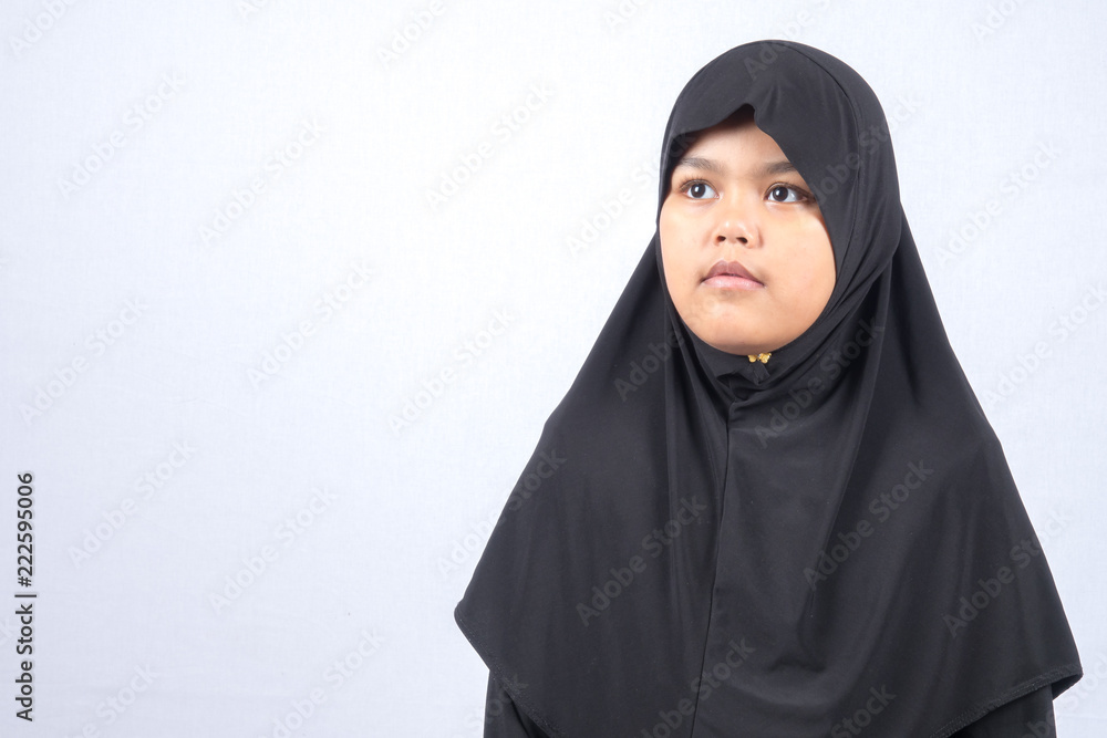 Potrait of young asian muslim boy/girl isolated on white background. Potrait of young asian muslim boy/girl isolated on white background.