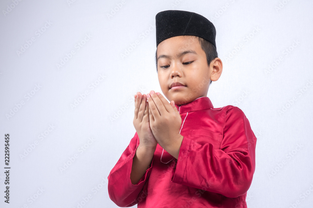 Potrait of young asian muslim boy/girl isolated on white background. Potrait of young asian muslim boy/girl isolated on white background.