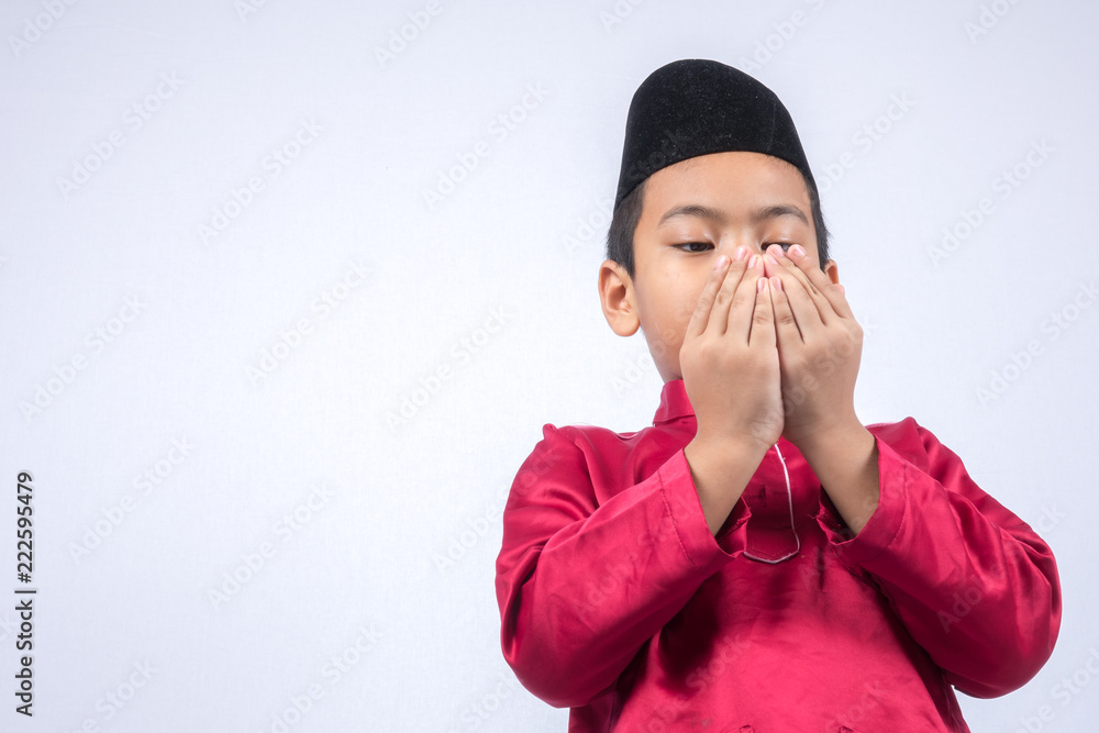 Potrait of young asian muslim boy/girl isolated on white background. Potrait of young asian muslim boy/girl isolated on white background.