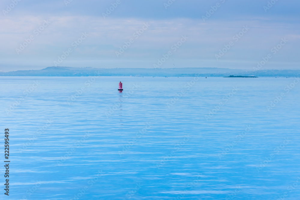 Blue hour - river landscape with buoy