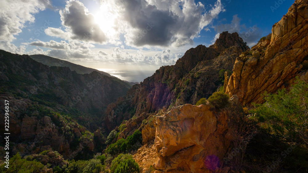 Famous road through Calanches de Piana at sunset in summer