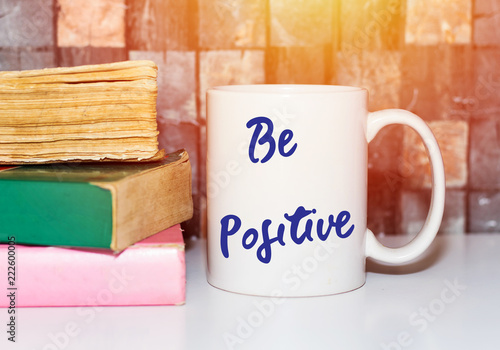 be positive Coffee Cup and books Concept 