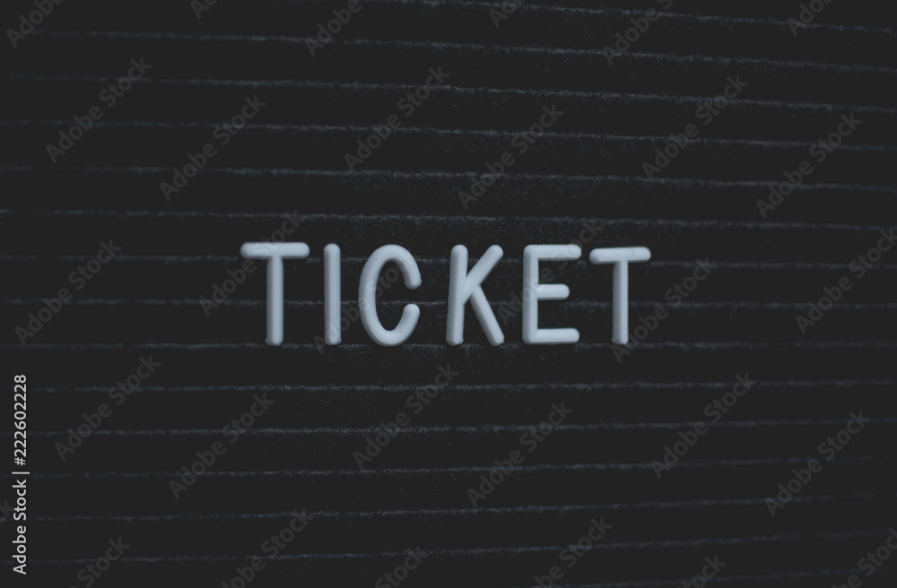 Word ticket written on the letter board. White letters on the black background. Business concept Word ticket written on the letter board. White letters on the black background. Business concept