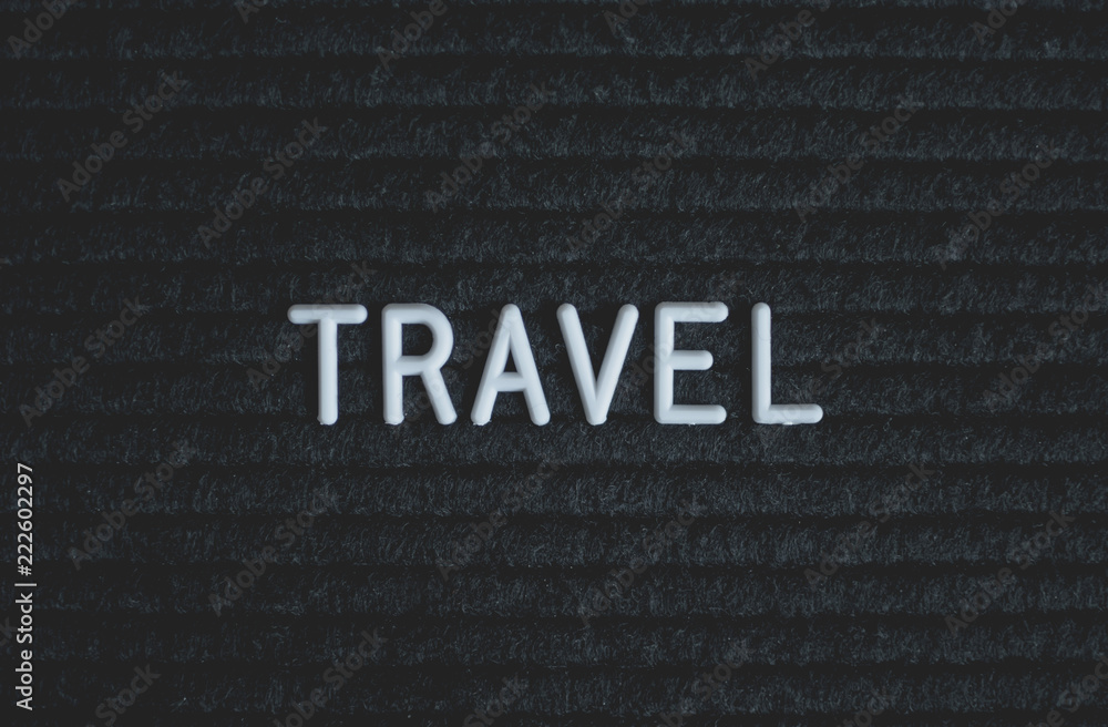 Word travel written on the letter board. White letters on the black background. Business concept Word travel written on the letter board. White letters on the black background. Business concept