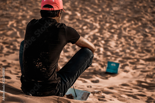 Children surfing on sand, Red Sand Dunes, Mui Ne, Phan Thiet, Vietnam