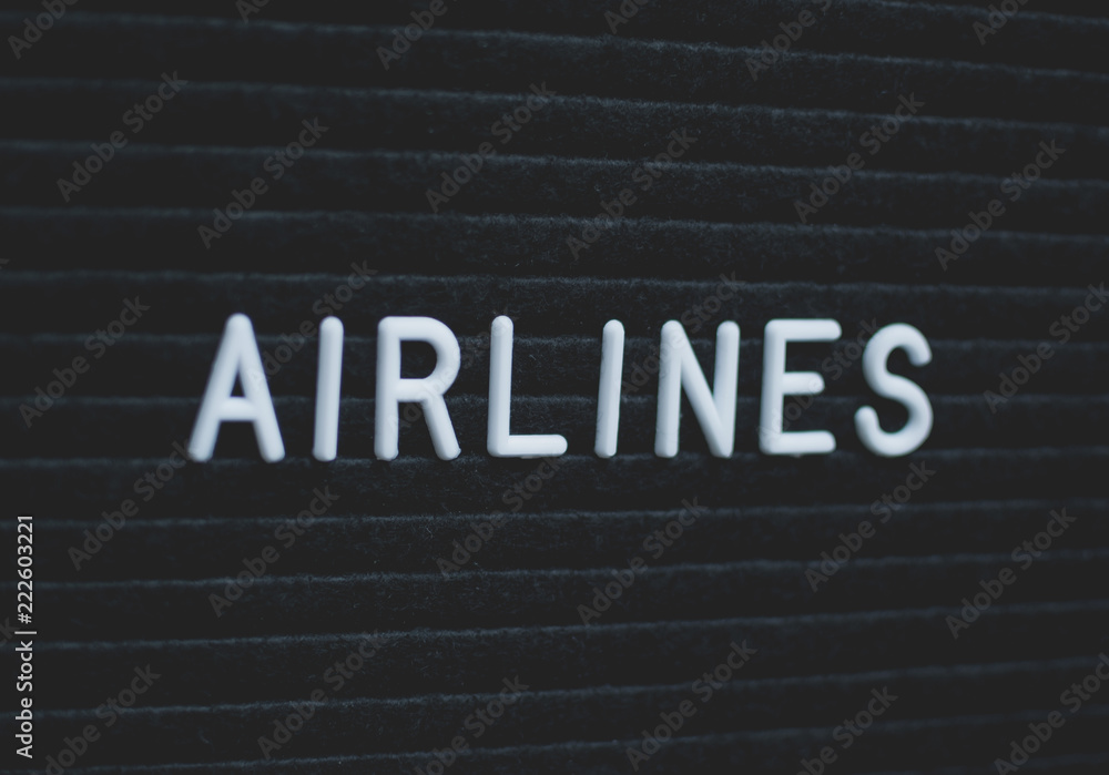 Word airlines written on the letter board. White letters on the black background. Business concept Word airlines written on the letter board. White letters on the black background. Business concept