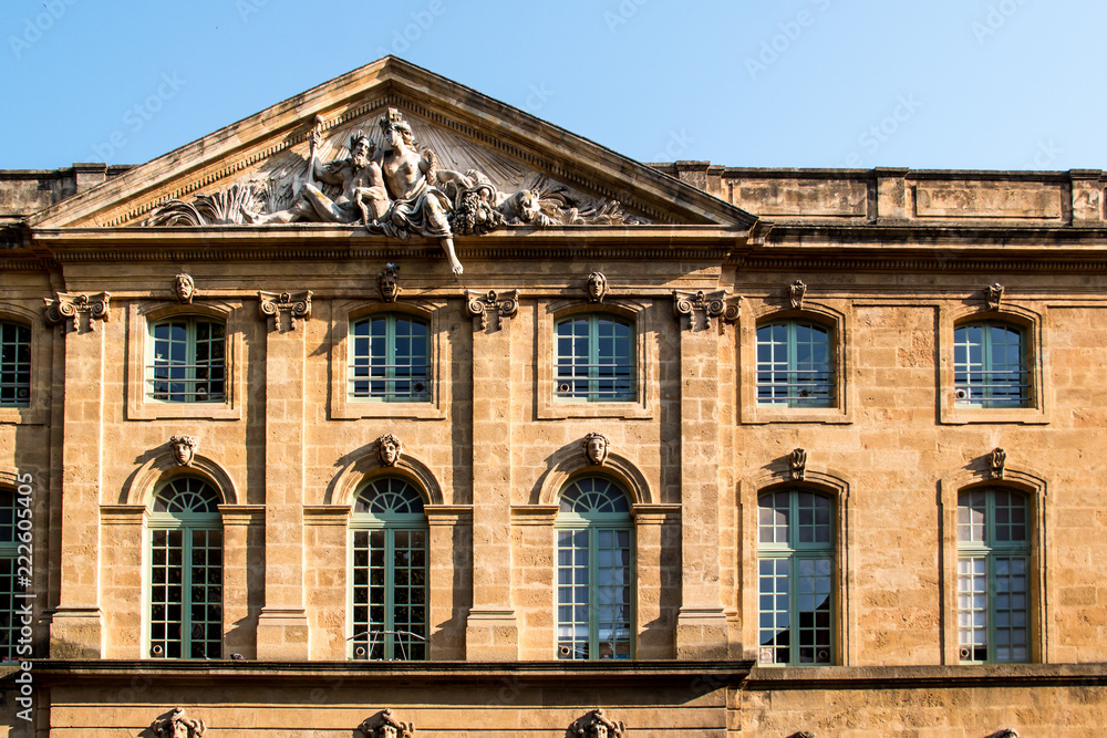 Post office's facade at Place de l'Hotel de Ville (Aix en Provence) that depicts Rhone River and the importance of navigation