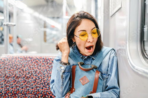 Принти на полотні sleepy woman yawn in train or metro, sleepless and insomnia concept