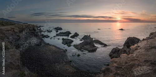 Obraz zachód słońca na wybrzeżu morza