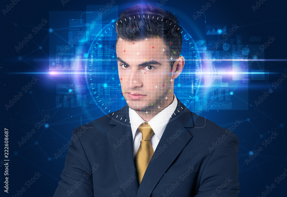 Facial recognition system. Young man on blue background Facial recognition system. Young man on blue background