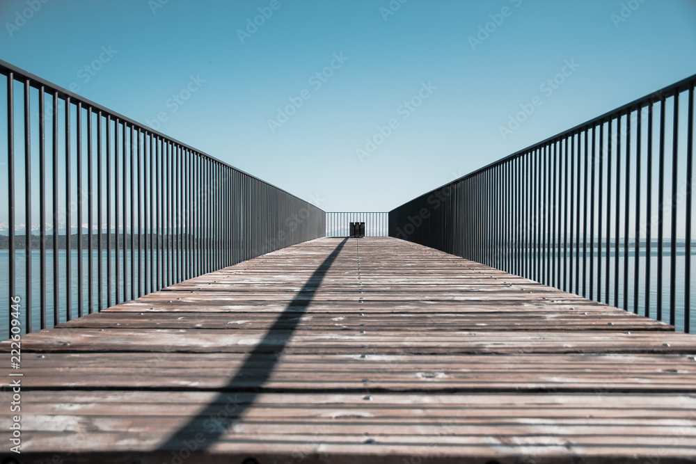 Wooden deck with metal railings at Neuchâtel Lake in Switzerland