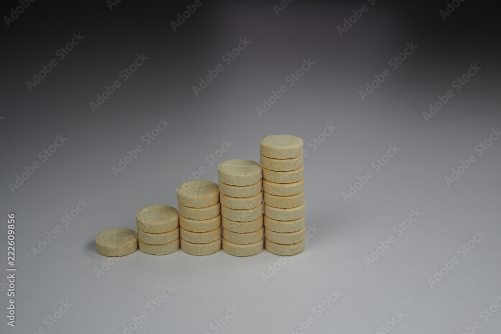columns of yellow tablets in the form of an ascending chart columns of yellow tablets in the form of an ascending chart